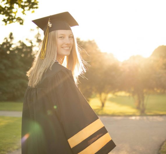 a person wearing a graduation cap and gown